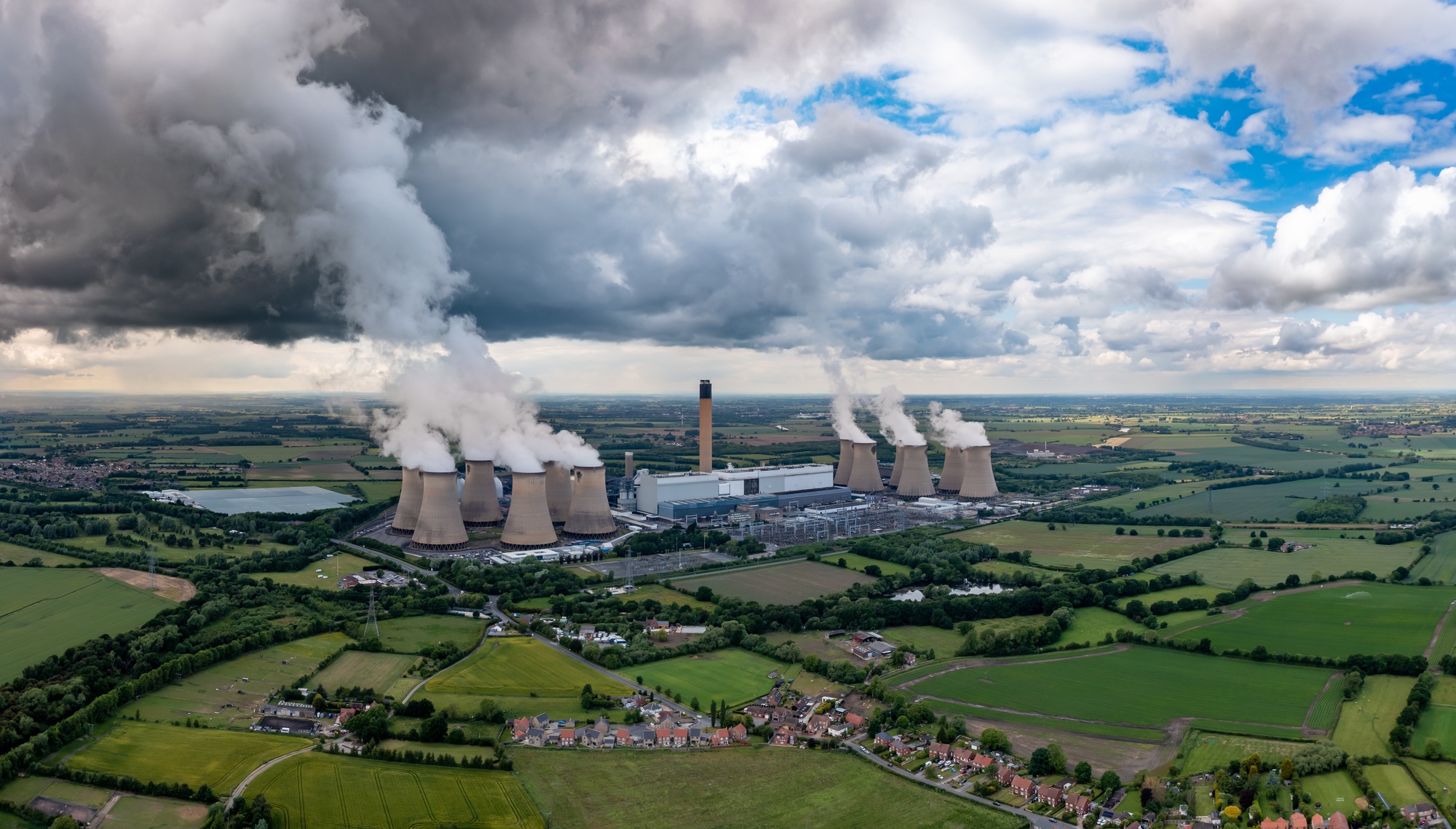 Coal fired power station with pollution emissions in an aerial landscape image
